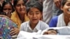 People mourn next to the body of Muddasir Khan, who was wounded in a clash between people demonstrating for and against a new citizenship law, after he succumbed to his injuries, in a riot-affected area in New Delhi, February 27, 2020