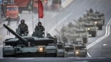 Russian T-90M tanks travel through central Moscow during a rehearsal for the May 9 Victory Day parade.