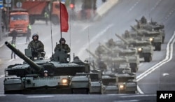 Russian T-90M tanks travel through Moscow during a rehearsal for the May 9 Victory Day parade.