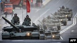 Russian T-90M tanks travel through Moscow during a rehearsal for the May 9 Victory Day parade.