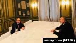 Armenian Prime Minister Nikol Pashinian (left) and Azerbaijani President Ilham Aliyev in Munich on February 15. 