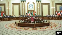 Senior parliamentary members from Iraq and neighboring countries meet on April 19 in Baghdad.