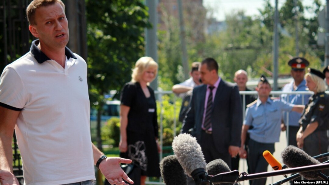 Russian opposition blogger Aleksei Navalny talks to reporters before meeting with police investigators on July 31. 