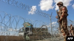 Pakistani soldiers keep watch at the Pakistan-Afghanistan border on March 19.